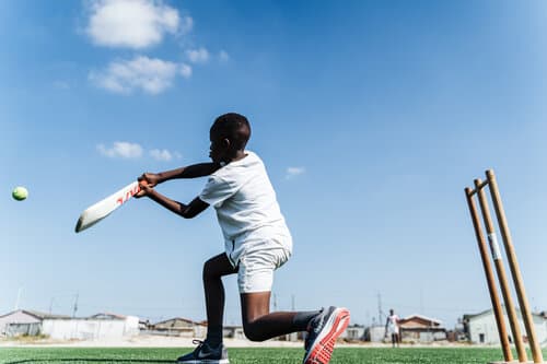 Young cricketer batting during a Catch Trust session in South Africa